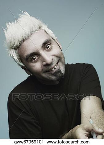 Portrait of a young man injecting a drug and smiling View Large Photo Image Stock Image - Portrait of a young man injecting a drug and smiling. Fotosearch