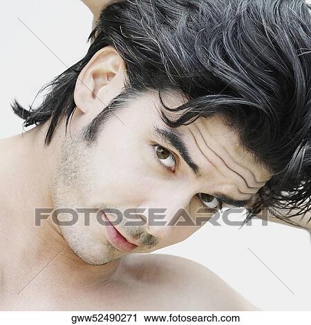 Portrait of a young man posing View Large Photo Image Stock Image - Portrait of a young man posing. Fotosearch