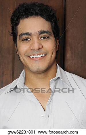 Stock Image - Portrait of a young man smiling. Fotosearch