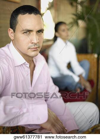 Portrait of a young man with a teenage girl in the background View Large Photo Image Stock Image - Portrait of a young man with a teenage girl in the background. Fotosearch