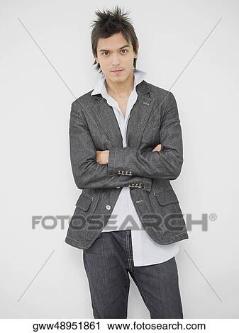 Portrait of a young man with his arms crossed View Large Photo Image Stock Image - Portrait of a young man with his arms crossed. Fotosearch