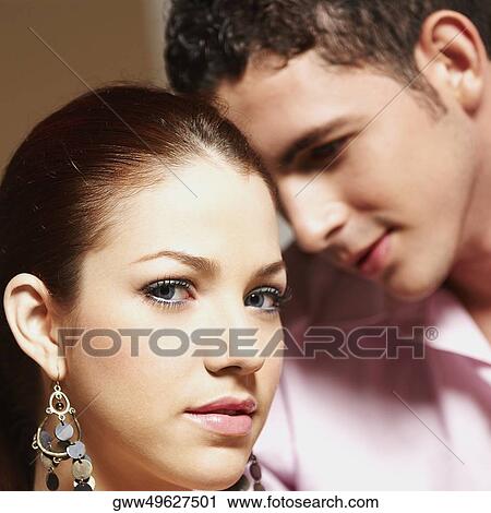 Stock Image - Portrait of a young woman and a teenage boy. Fotosearch