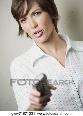 Portrait of a young woman puckering and holding a tape recorder View Large Photo Image Stock Image - Portrait of a young woman puckering and holding a tape recorder. Fotosearch