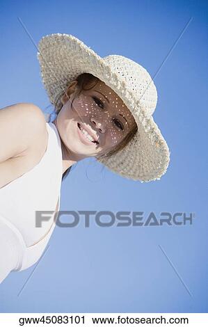 Portrait of a young woman smiling View Large Photo Image Stock Image - Portrait of a young woman smiling. Fotosearch