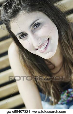 Portrait of a young woman smiling View Large Photo Image Stock Image - Portrait of a young woman smiling. Fotosearch