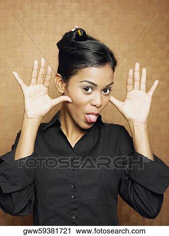 Portrait of a young woman teasing View Large Photo Image Stock Image - Portrait of a young woman teasing. Fotosearch