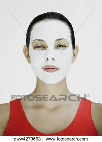 Portrait of a young woman with a facial mask View Large Photo Image Stock Image - Portrait of a young woman with a facial mask. Fotosearch