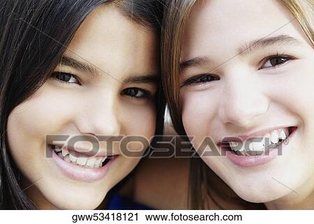 Portrait of two girls smiling View Large Photo Image Stock Image - Portrait of two girls smiling. Fotosearch
