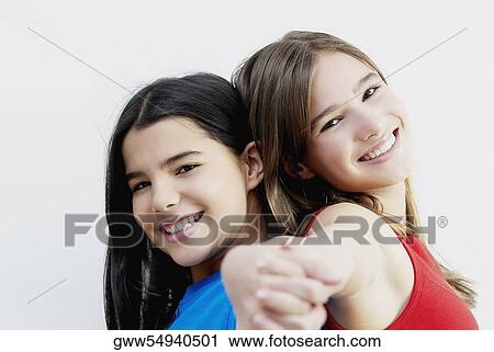 Portrait of two girls smiling View Large Photo Image Stock Image - Portrait of two girls smiling. Fotosearch