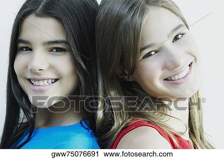 Portrait of two girls smiling View Large Photo Image Stock Image - Portrait of two girls smiling. Fotosearch