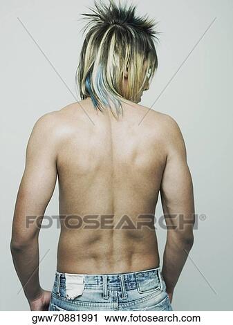 Stock Image - Rear view of a semi-dressed young man. Fotosearch