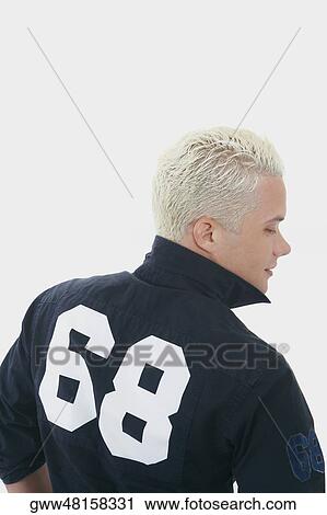Rear view of a young man View Large Photo Image Stock Image - Rear view of a young man. Fotosearch