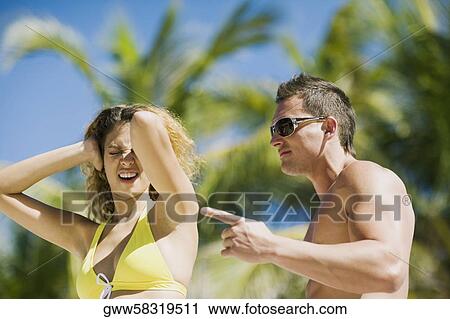 Side profile of a young man blaming a young woman View Large Photo Image Stock Image - Side profile of a young man blaming a young woman. Fotosearch