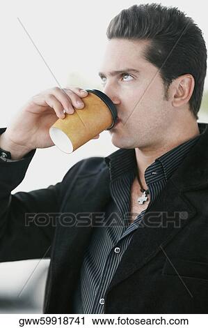 Side profile of a young man drinking coffee View Large Photo Image Stock Image - Side profile of a young man drinking coffee. Fotosearch