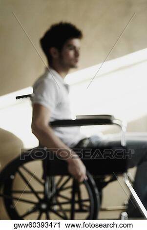 Side profile of a young man sitting in a wheelchair View Large Photo Image Stock Image - Side profile of a young man sitting in a wheelchair. Fotosearch