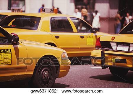 Taxis moving on the road, Manhattan, New York City, New York State, USA View Large Photo Image Stock Image - Taxis moving on the road, Manhattan, New York City, New York State, USA. Fotosearch