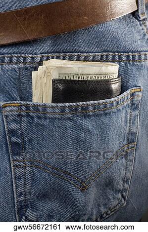 Wallet filled with paper currency in the pocket of a pair of jeans View Large Photo Image Stock Image - Wallet filled with paper currency in the pocket of a pair of jeans. Fotosearch