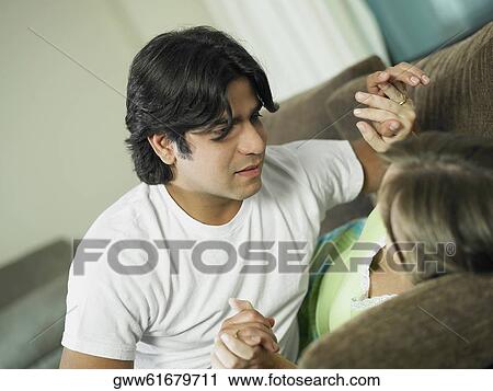 Young man holding a young woman's hands View Large Photo Image Stock Image - Young man holding a young woman's hands. Fotosearch