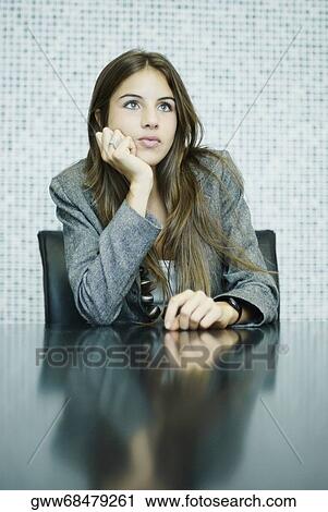 Young woman thinking View Large Photo Image Stock Image - Young woman thinking. Fotosearch