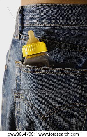 Close-up of a baby bottle tucked in a person's back pocket View Large Photo Image Stock Image - Close-up of a baby bottle tucked in a person's back pocket. Fotosearch