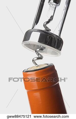 Stock Image - Close-up of a bottle with a corkscrew. Fotosearch