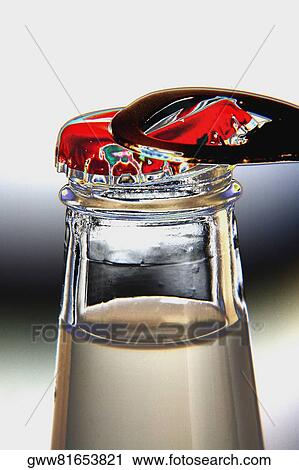 Close-up of a bottle with an opener View Large Photo Image Stock Image - Close-up of a bottle with an opener. Fotosearch