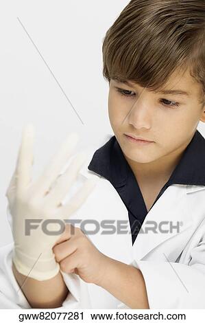 Close-up of a boy dressed as a doctor View Large Photo Image Stock Image - Close-up of a boy dressed as a doctor. Fotosearch