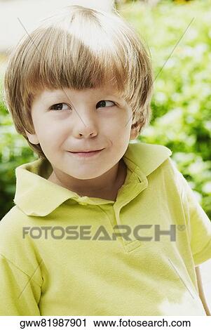 Stock Image - Close-up of a boy grinning. Fotosearch