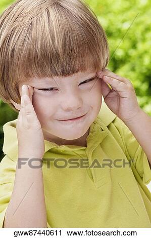 Close-up of a boy making a face View Large Photo Image Stock Image - Close-up of a boy making a face. Fotosearch