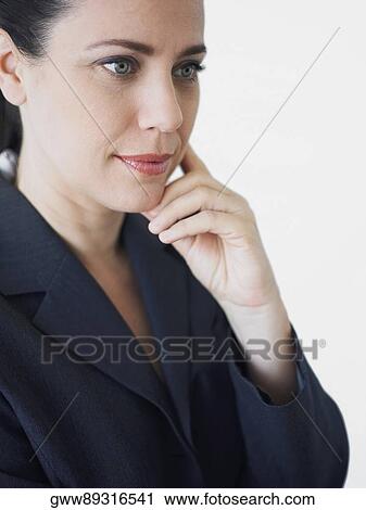 Stock Image - Close-up of a businesswoman looking away. Fotosearch