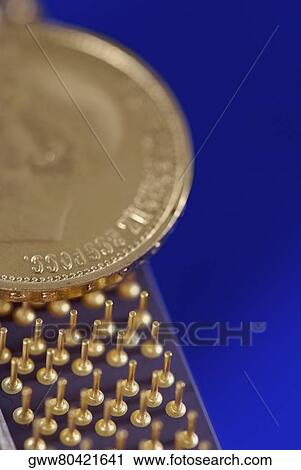 Close-up of a coin on a computer chip View Large Photo Image Stock Image - Close-up of a coin on a computer chip. Fotosearch