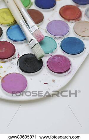 Close-up of a color palette with paintbrushes View Large Photo Image Stock Image - Close-up of a color palette with paintbrushes. Fotosearch