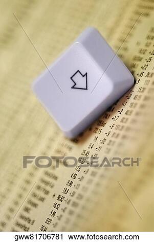 Close-up of a computer key on newspaper View Large Photo Image Stock Image - Close-up of a computer key on newspaper. Fotosearch