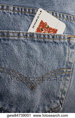 Close-up of a joker playing card in the pocket of a pair of jeans View Large Photo Image Stock Image - Close-up of a joker playing card in the pocket of a pair of jeans. Fotosearch
