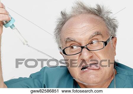 Close-up of a male doctor with an iv drip around his neck View Large Photo Image Stock Image - Close-up of a male doctor with an iv drip around his neck. Fotosearch