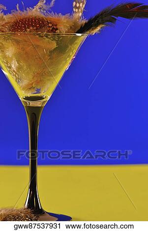 Close-up of a martini glass full of feathers View Large Photo Image Stock Image - Close-up of a martini glass full of feathers. Fotosearch