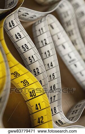 Close-up of a measuring tape View Large Photo Image Stock Image - Close-up of a measuring tape. Fotosearch