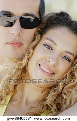 Close-up of a mid adult man and a young woman View Large Photo Image Stock Image - Close-up of a mid adult man and a young woman. Fotosearch
