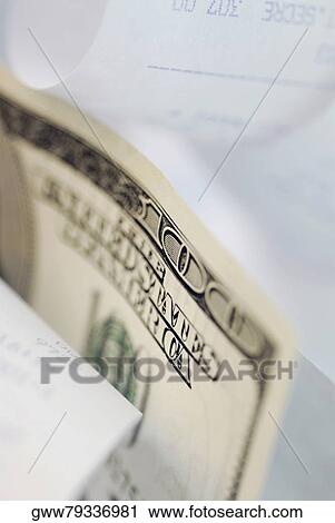 Close-up of a one hundred dollar bill with paper receipts View Large Photo Image Stock Image - Close-up of a one hundred dollar bill with paper receipts. Fotosearch