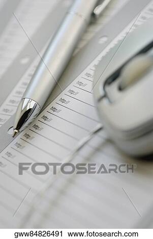 Close-up of a pen and a computer mouse on a sheet of paper View Large Photo Image Stock Image - Close-up of a pen and a computer mouse on a sheet of paper. Fotosearch