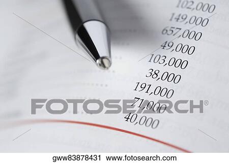 Close-up of a pen on a financial document View Large Photo Image Stock Image - Close-up of a pen on a financial document. Fotosearch