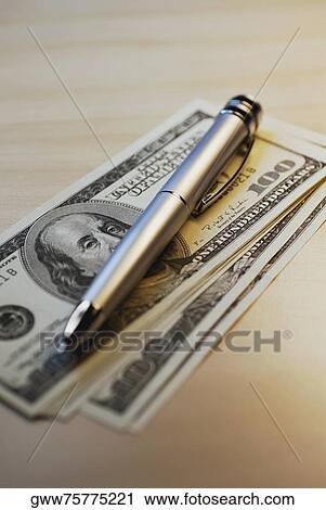 Close-up of a pen on one hundred dollar bills View Large Photo Image Stock Image - Close-up of a pen on one hundred dollar bills. Fotosearch