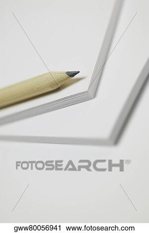 Close-up of a pencil on a notepad View Large Photo Image Stock Image - Close-up of a pencil on a notepad. Fotosearch