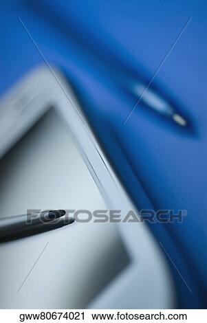 Stock Image - Close-up of a personal data assistant with a digitized pen. Fotosearch
