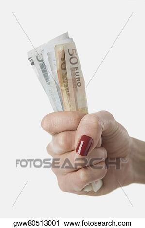 Close-up of a person's hand holding Euro bank notes View Large Photo Image Stock Image - Close-up of a person's hand holding Euro bank notes. Fotosearch