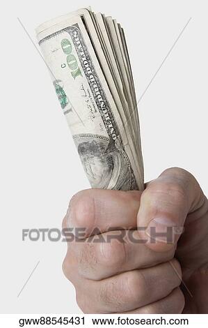 Close-up of a person's hand holding dollar bills View Large Photo Image Stock Image - Close-up of a person's hand holding dollar bills. Fotosearch
