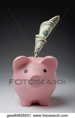 Close-up of a piggybank with rolled paper currency notes in its slot View Large Photo Image Stock Image - Close-up of a piggybank with rolled paper currency notes in its slot. Fotosearch