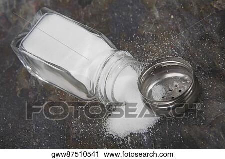 Close-up of a salt spilling from a salt shaker View Large Photo Image Stock Image - Close-up of a salt spilling from a salt shaker. Fotosearch