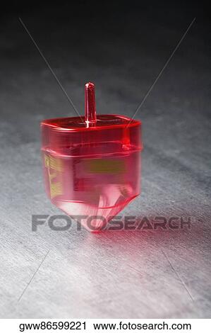 Close-up of a spinning top View Large Photo Image Stock Image - Close-up of a spinning top. Fotosearch