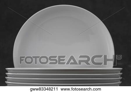 Close-up of a stack of plates View Large Photo Image Stock Image - Close-up of a stack of plates. Fotosearch